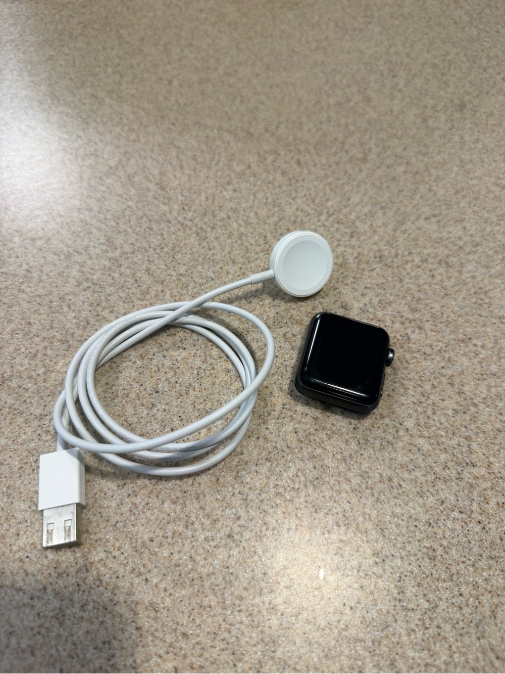 Apple Black Smartwatch with White Magnetic Charger